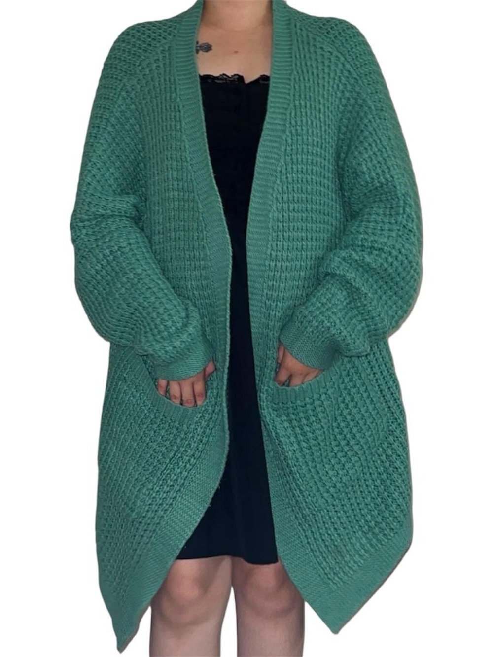 Green waffle knit cardigan.